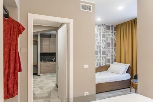a small bedroom with a bed in a room at APARTHOTEL CASA MIA in Milan
