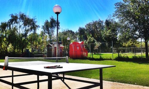 a picnic table in a park with a playground at Entrerrobles in Valdeavellano de Tera
