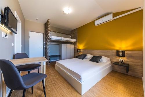 Postel nebo postele na pokoji v ubytování Apartments Gavran
