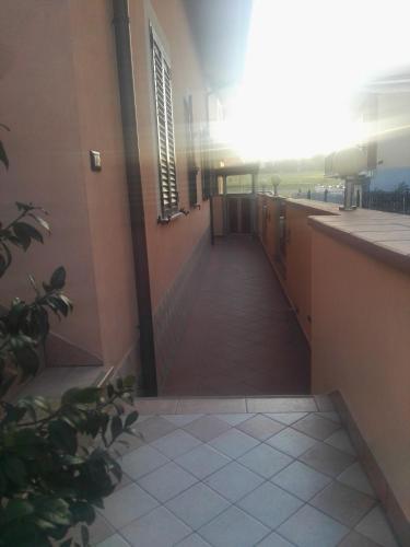 a hallway of a building with a tile floor at Le mansarde di Via Isonzo in Chieti