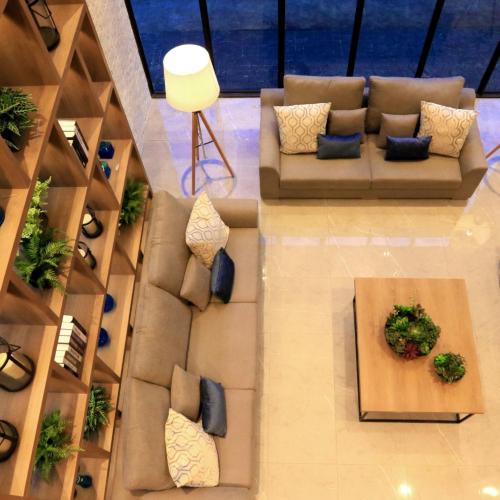 an overhead view of a living room with a couch at B Stay Hotel in Bangkok