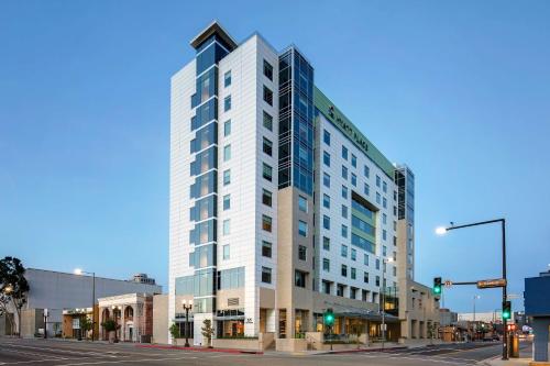 a tall white building on the corner of a street at Hyatt Place Glendale/Los Angeles in Glendale