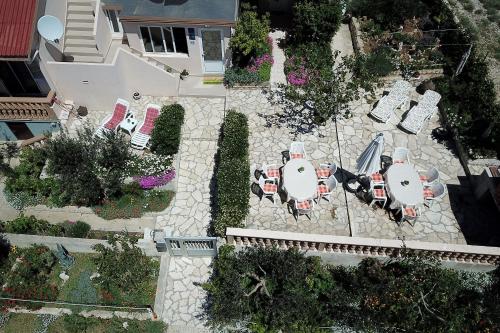 an overhead view of a patio with tables and chairs at Apartments Anka in Rtina
