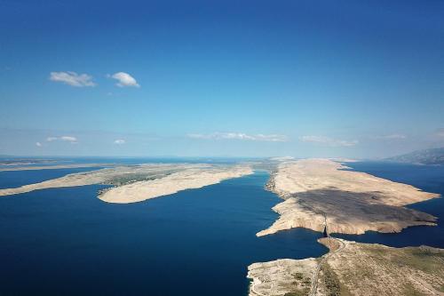 an island in the middle of a body of water at Apartments Anka in Rtina