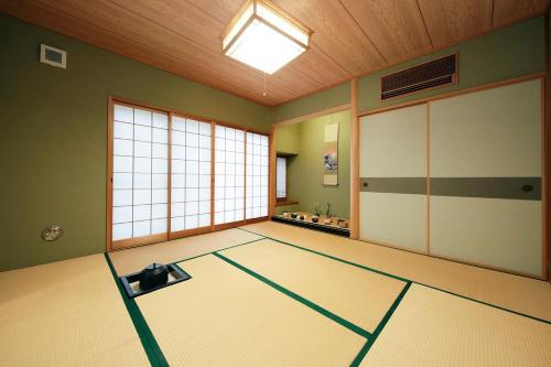 an empty room with a karate room with a mats at Ryokan ASAKUSA-chaka- by Tranova in Tokyo