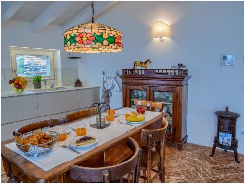 a dining room with a table with food on it at Villa Aquarius - Larihome A08 in Vercana