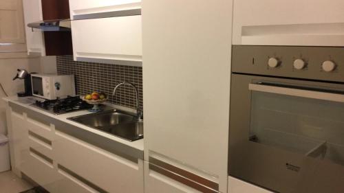 Cuisine ou kitchenette dans l'établissement Palazzo Sum Avola