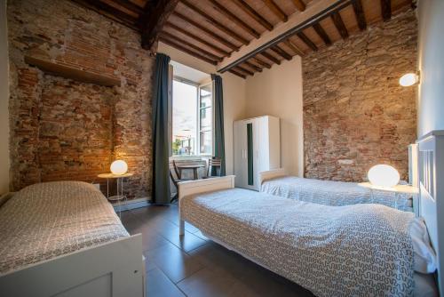 Postel nebo postele na pokoji v ubytování Ostello Palazzo Nizza