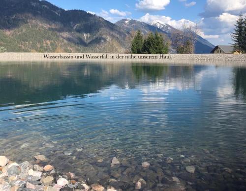a view of a lake with mountains in the background at Studio Holunder Weissbriach in Weissbriach