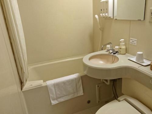a small bathroom with a sink and a toilet at Hotel Oaks Early-Bird Osaka Morinomiya/ Vacation STAY 28691 in Osaka
