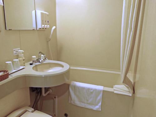 a bathroom with a sink and a toilet and a shower at Hotel Oaks Early-Bird Osaka Morinomiya/ Vacation STAY 28791 in Osaka