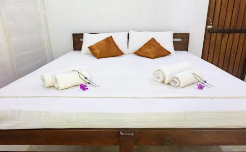 Voodi või voodid majutusasutuse Sinharaja Vini Villa toas