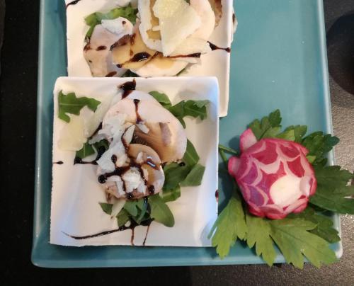 three plates of food on a blue tray at Hotel Lady Mary in Milano Marittima