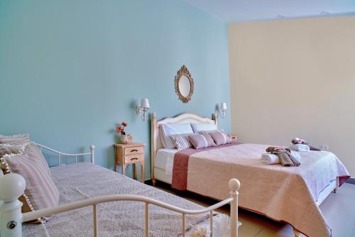 Postel nebo postele na pokoji v ubytování Corali House