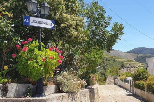 a street sign for an al cross contraceptives street at Casa Rodrigues in Pinhão