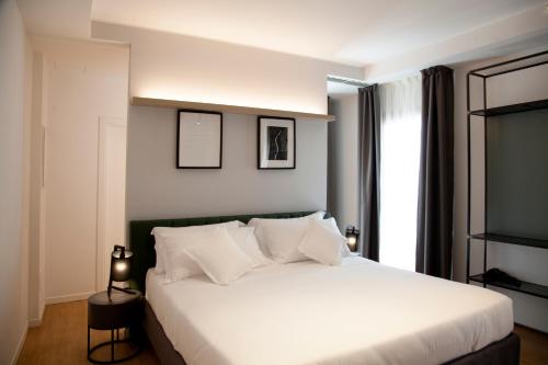 Cama ou camas em um quarto em Meg Lifestyle Hotel & Apartaments