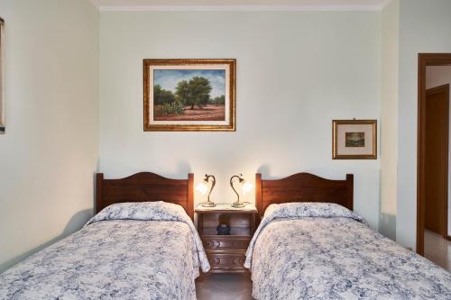 Ένα ή περισσότερα κρεβάτια σε δωμάτιο στο Casa Renata free covered private parking