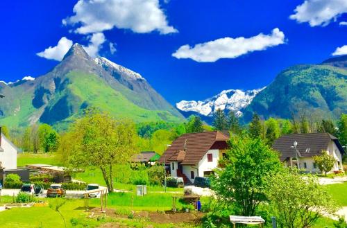 a village with a mountain in the background at Bovec Holiday House in Bovec