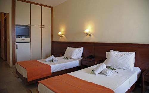 Ένα ή περισσότερα κρεβάτια σε δωμάτιο στο Elysee hotel