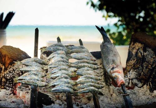 a group of fish on top of a grill at New Central Studio Torremolinos in Torremolinos