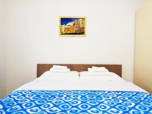 Ένα ή περισσότερα κρεβάτια σε δωμάτιο στο Zea Waves apartments