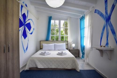 Una cama o camas en una habitación de Villa Spiaggia Bianca
