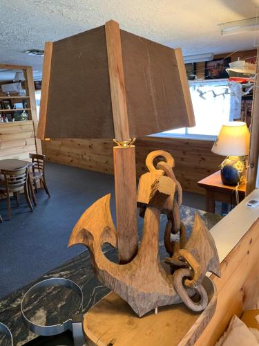 a wooden anchor on a table in a room at Hopewell Rocks Motel & Country Inn in Hopewell Cape