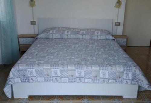 מיטה או מיטות בחדר ב-Casa Vacanze Breva