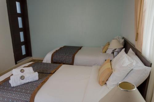 Postel nebo postele na pokoji v ubytování Hotel Shalom
