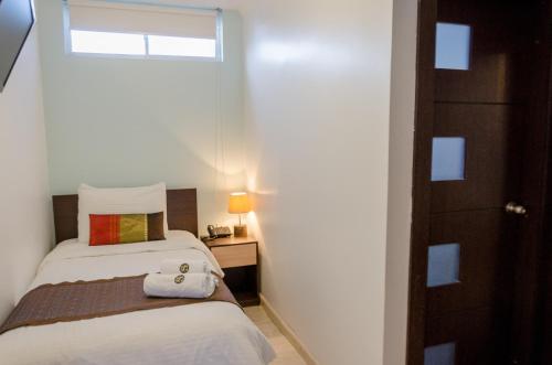 Postel nebo postele na pokoji v ubytování Hotel Shalom
