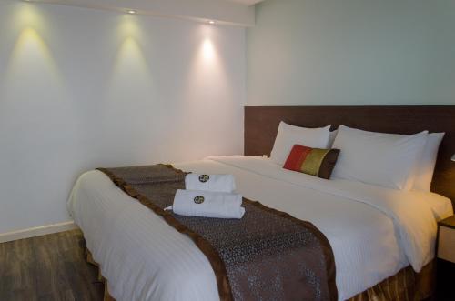 Postel nebo postele na pokoji v ubytování Hotel Shalom