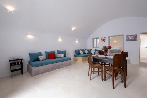 a living room with a couch and a table at Labyrinth Traditional Houses in Pirgos