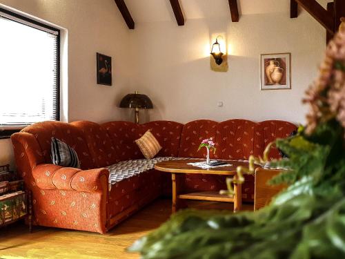 a living room with a couch and a table at Apartment Franciska in Rakovica