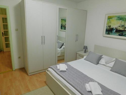 Postel nebo postele na pokoji v ubytování Apartment Doni