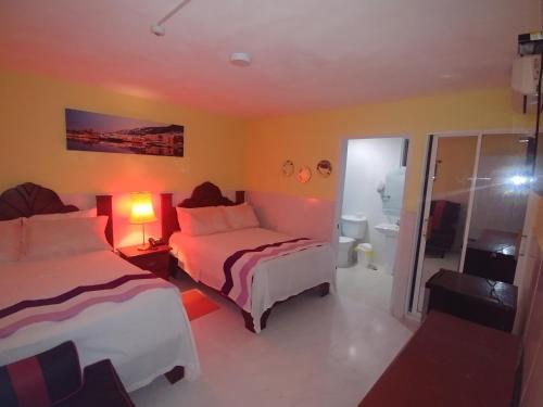 Ένα ή περισσότερα κρεβάτια σε δωμάτιο στο Hotel Riparbella