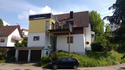 a black car parked in front of a house at Haus Rebblick in Offenburg