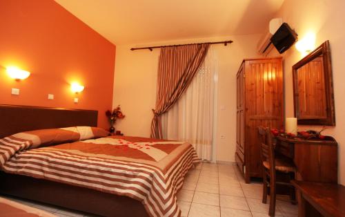 Ένα ή περισσότερα κρεβάτια σε δωμάτιο στο Kostalina Hotel Studios