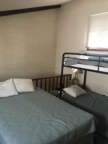 a bedroom with two bunk beds and a window at 106 Village at Camelback in Tannersville
