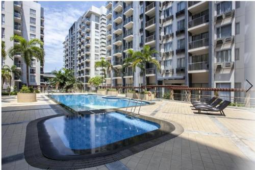 a swimming pool in the middle of a building at Condo Unit Near Terminal 3 in Manila