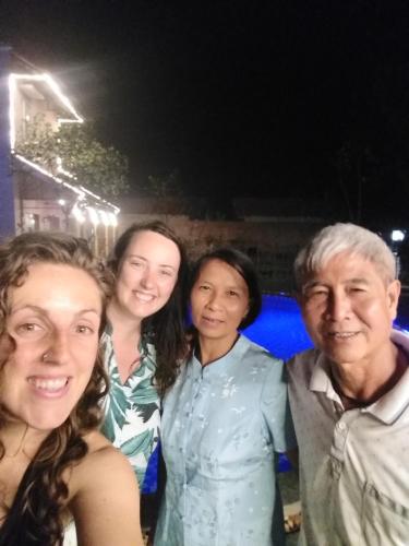 a group of people posing for a picture at night at Ruby Homestay in Ninh Binh