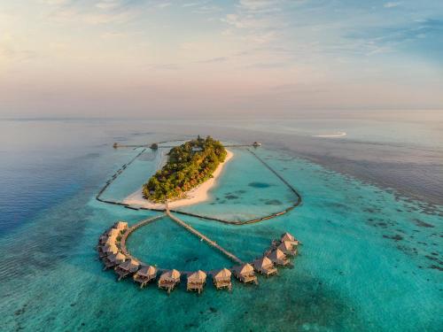 an island in the middle of the ocean at Komandoo Island Resort & Spa in Komandoo