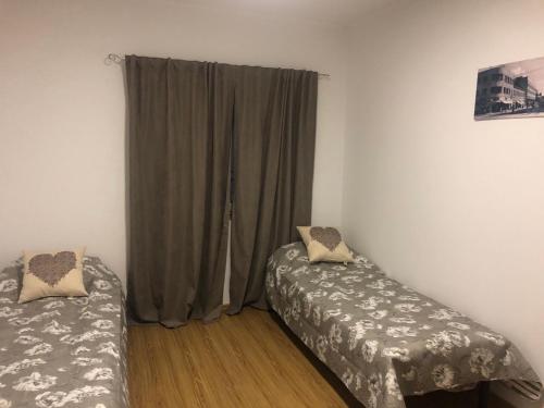
Кровать или кровати в номере Апартаменты в центре города
