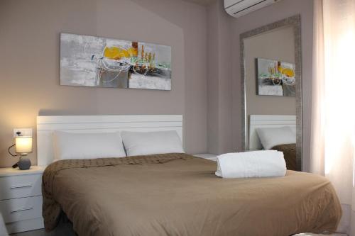 Un ou plusieurs lits dans un hébergement de l'établissement Apartamento Jardines de Cuenca
