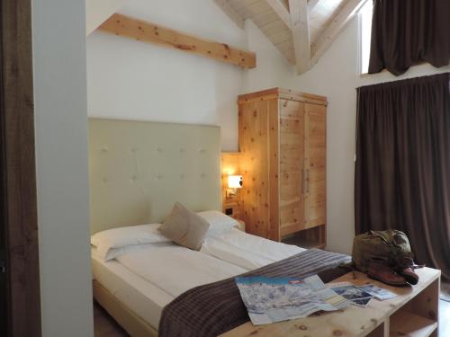 Llit o llits en una habitació de Hotel Scoiattolo