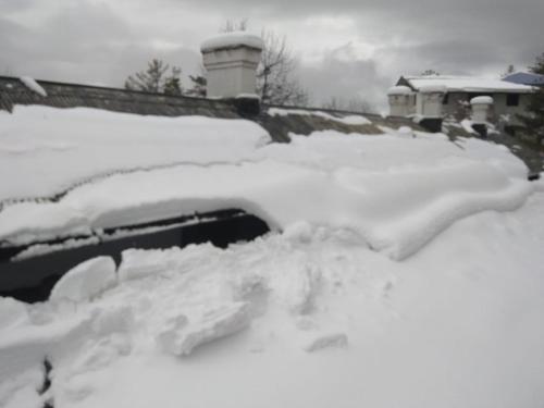 a pile of snow on top of a car at BRIGHTLANDS HOTEL in Murree