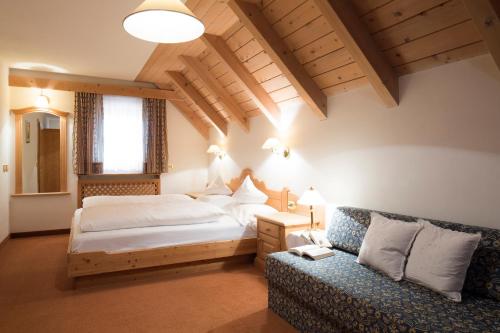 En eller flere senge i et værelse på Residence La Selva