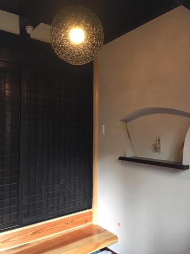 a room with a window and a light fixture at Koiya in Kameoka