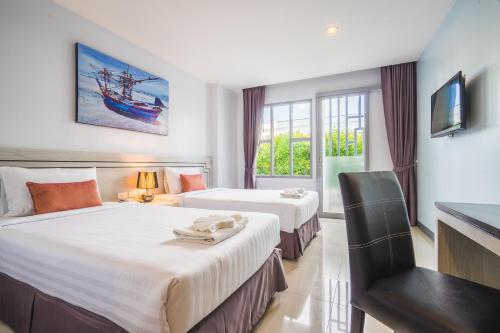 Postel nebo postele na pokoji v ubytování Vapa Hotel - SHA Extra Plus