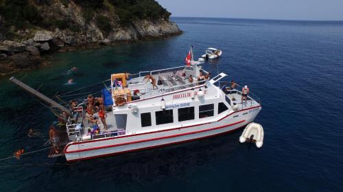 a group of people on a boat in the water at Bike&Boat Argentario Hotel in Porto Santo Stefano