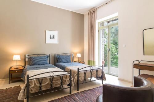 Postel nebo postele na pokoji v ubytování Hotel Marathia